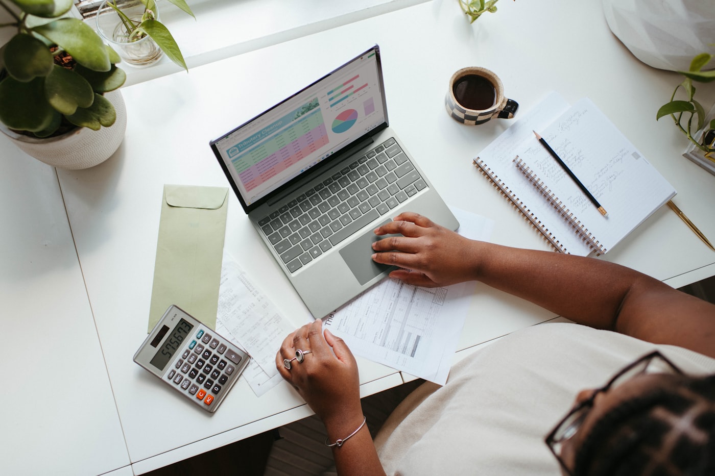 Business owner reviewing financials to learn what their company is worth